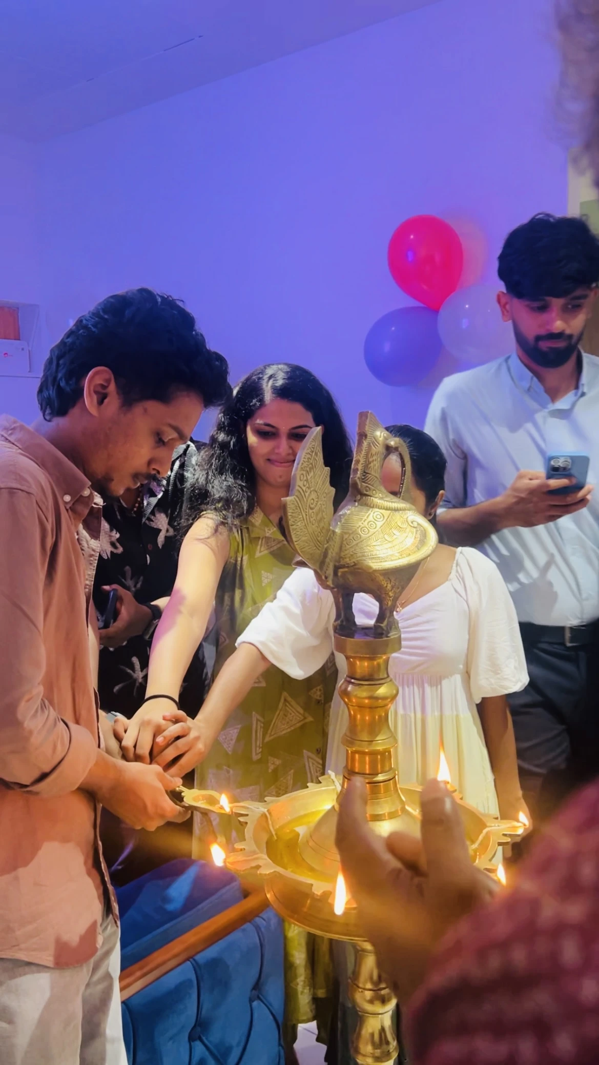 Team members celebrating together during the lamp-lighting ceremony